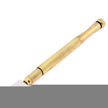 Gold metal glass cutter for precision.