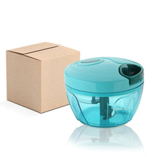 Compact vegetable chopper with stainless steel blades, shown in brown package box.